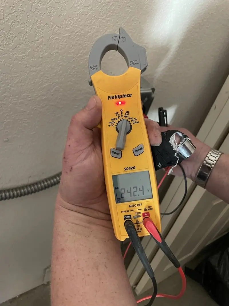 Voltage testing with clamp meter during Circuit Breaker Repair in West Haven